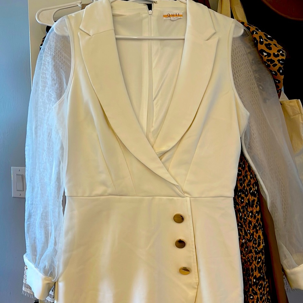 White romper with mesh sleeves and gold button